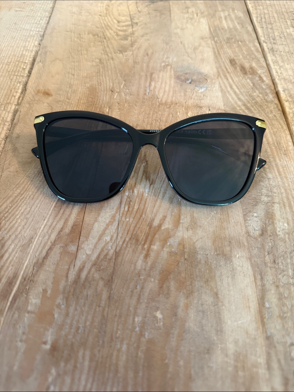 Women’s Black Cat-Eye Sunglasses with Gold Accents